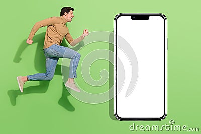 Profile photo of crazy carefree nice sporty guy run jump wear beige shirt jeans footwear isolated green color background Stock Photo