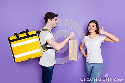 Profile photo overjoyed lady raise thumb finger up advising fast delivery courier guy hold present bag speed best Stock Photo