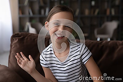 Portrait of smiling girl child talk on webcam call Stock Photo