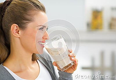 Profile portrait of woman drinking fresh smoothie Stock Photo