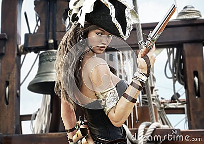 Profile of a Pirate female captain standing on the deck of her ship with pistol in hand. Stock Photo