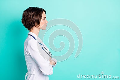 Profile side photo of young woman serious crossed hands look empty space coronavirus isolated over teal color background Stock Photo