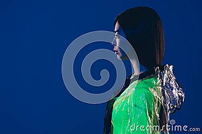 Profile side photo of youth lady empty space advise rainy garment wear rubber coat isolated vivid color background Stock Photo