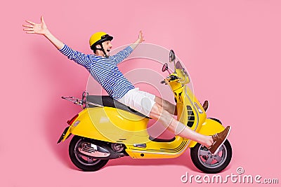 Profile side view of his he nice attractive handsome cheerful cheery crazy foolish guy reckless driving moped without Stock Photo