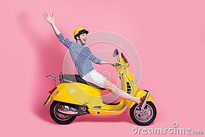 Profile side view of his he nice attractive handsome cheerful cheery crazy funky guy reckless driving moped having fun Stock Photo