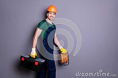 Profile side view portrait of his he nice attractive cheerful professional qualified workman walking renovation service Stock Photo