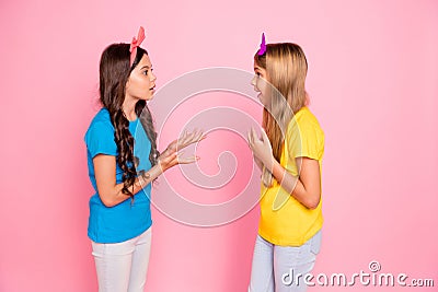 Profile side view portrait of two nice-looking attractive charming cute lovely discontent puzzled confused pre-teen Stock Photo