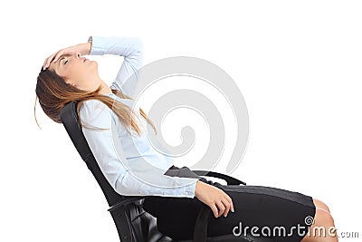 Profile of a tired businesswoman sitting on a chair Stock Photo