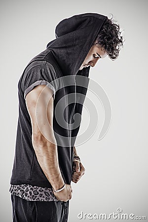 Profile of tough young man in dark t-shirt Stock Photo