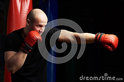 Profile view of punching boxer Stock Photo