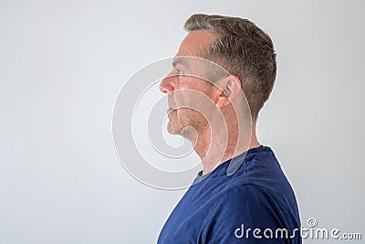 Profile view of an unshaven middle-aged man Stock Photo