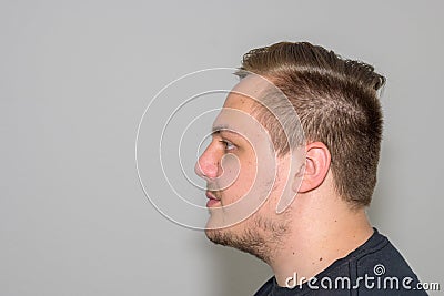 Profile view of a young man in his twenties Stock Photo