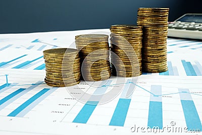 Profit Growth. Stacks of coins and business documents. Investment fund Stock Photo