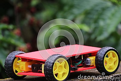 Programmable four wheels drive or 4WD robotic car with chasis. Hobby electronics project Stock Photo