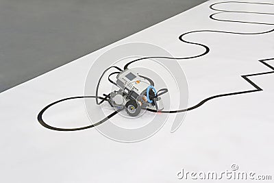 Programmable four wheels robotic car with line follow ability. robot driving on a line Stock Photo
