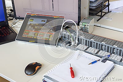 A programmable logic controller PLC or programmable controller. PLCs were first developed in the automobile manufacturing. Stock Photo