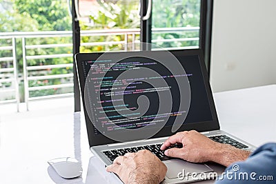 programmer coding, compiler, encode, debug, and developer application software for business corporate with laptop computer. Man Stock Photo