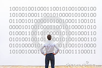 Programmer looking at binary code, coding concept, data encryption Stock Photo
