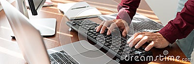 Programmer or software developer Typing New Lines of Code, coding technologies working at wooden industrial interior work place Stock Photo
