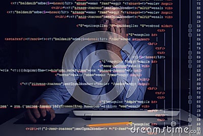 programmer working with programming code on computer screen Stock Photo