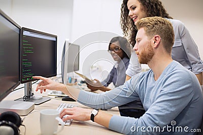 Programmer working in a software developing company Stock Photo