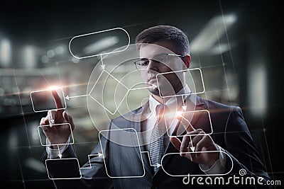The programmer works with a program flowchart Stock Photo
