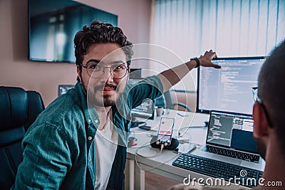 Programmers engrossed in deep collaboration, diligently working together to solve complex problems and develop Stock Photo
