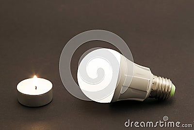 Progress of lighting with candle and LED bulb. Stock Photo