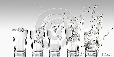 Progression of different splashes on a glass of water Stock Photo