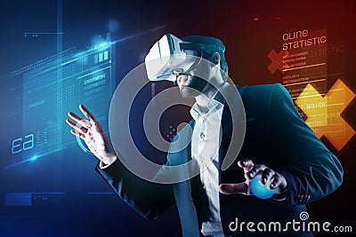 Progressive programmer wearing amazing virtual reality device while working Stock Photo