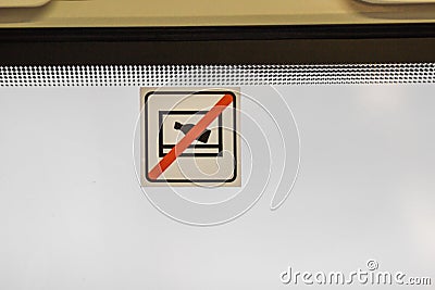 Prohibition sign - no alcohol in public place, the bottle crossed out with red line. Forbidden icon on the train window. Stock Photo