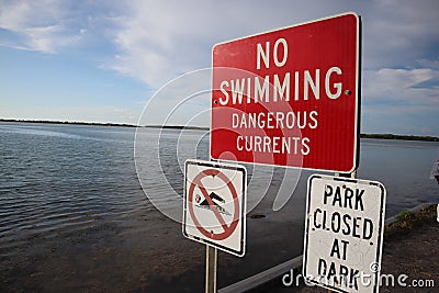 Prohibition sign swimming. No swimming allowed sign. Please don`t swim on the lake warning sign. Red indication informing to not s Stock Photo