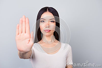 Prohibition symbol. Closeup portrait of young, serious, pretty g Stock Photo