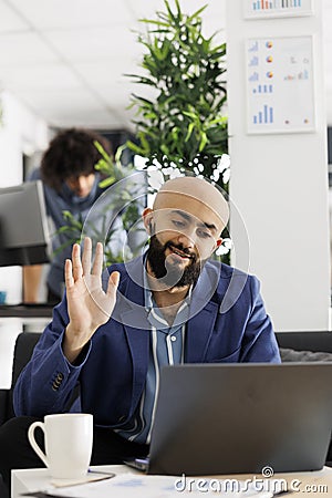 Project manager attending videoconference to discuss strategy with clients Stock Photo