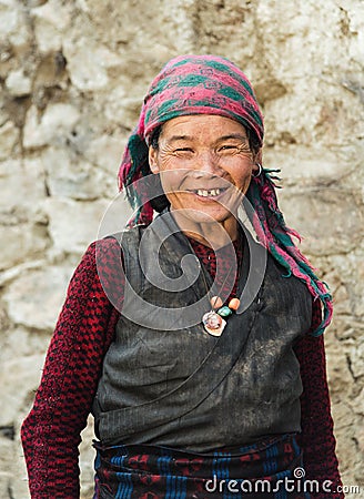 Portrait of a old smiling nepalese woman in national clothes near her Editorial Stock Photo