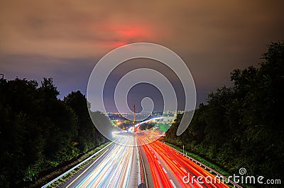 Prolonged exposure to traffic on a highway at night Stock Photo