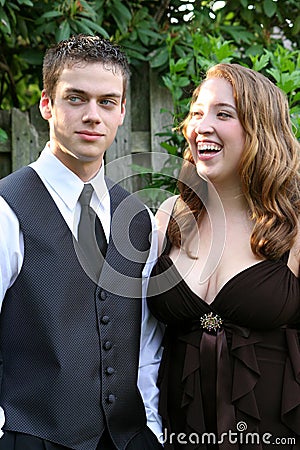 Prom Girl Laughing At Wary Date Stock Photo