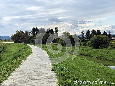 Promenade along the bank of the river Orljava or Setnica uz obalu rijeke Orljave Stock Photo