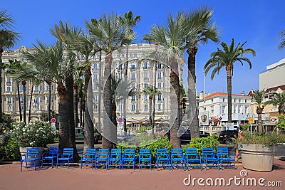 Promenade with blue chairs in the La Croisette in Cannes Editorial Stock Photo