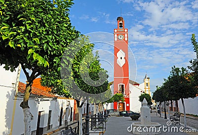 Promenade square of the Clock Tower in Almaden de la Plata, Seville province, Andalusia, Spain Stock Photo