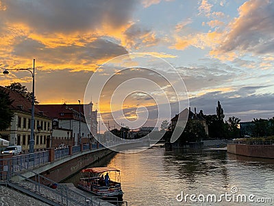 The promenade of Wroclaw - European Capital of Culture, view from river Odra, after sunset at night. Poland Editorial Stock Photo