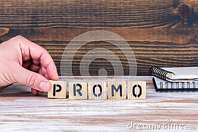 Promo. Wooden letters on the office desk Stock Photo