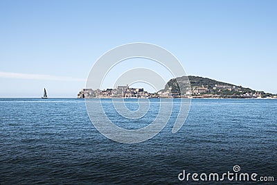 Promontory of Gaeta with sailing boat seen from the sea Stock Photo