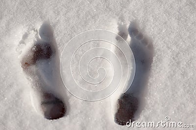 Top view of bare foot prints in the snow Stock Photo