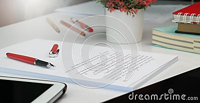 Proof reading paper on table Stock Photo