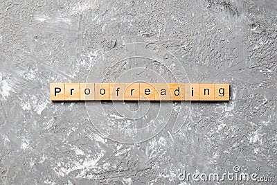 Proofreading word written on wood block. proofreading text on table, concept Stock Photo