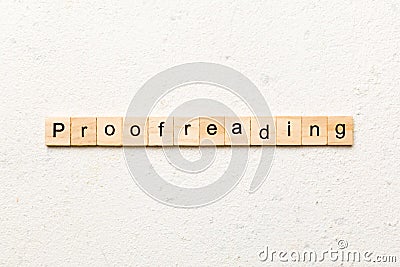 proofreading word written on wood block. proofreading text on table, concept Stock Photo