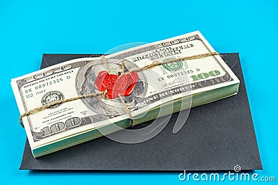 Prop Money Dollars.Full Print Old Style.100 Dollar Bills.Sealed brick with sealing wax and rope Stock Photo