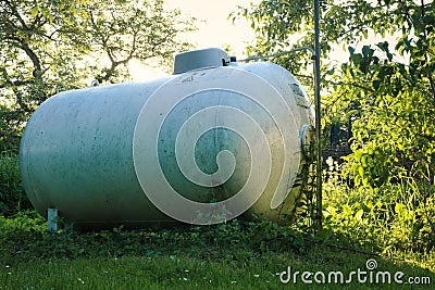 Propane tank in a backyard Stock Photo