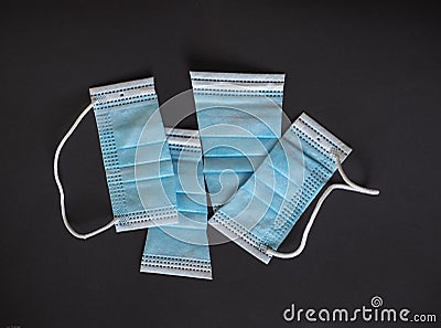 Proper disposal of used medical mask cut to prevent reuse Stock Photo